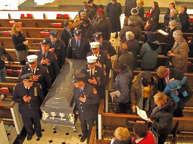 The men of Ladder 6 carry Josephine Harris one last time. - photographer unidentified