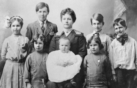 Sarah Benson with her 7 children (and 1 on the way) at the time of her husband's mission call to England.