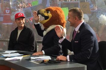 ESPN anchor Coach Corsco picks UTAH for the win and dons the Swoop Mascot head - flanked by John Stockton (left) and Kirk Herbstreit (right)