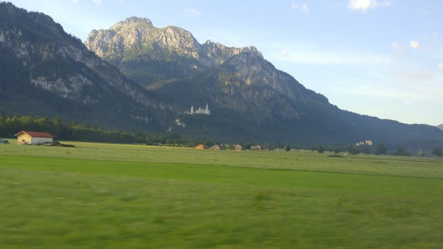 Neuschwanstein seen from the distance through my bus window.